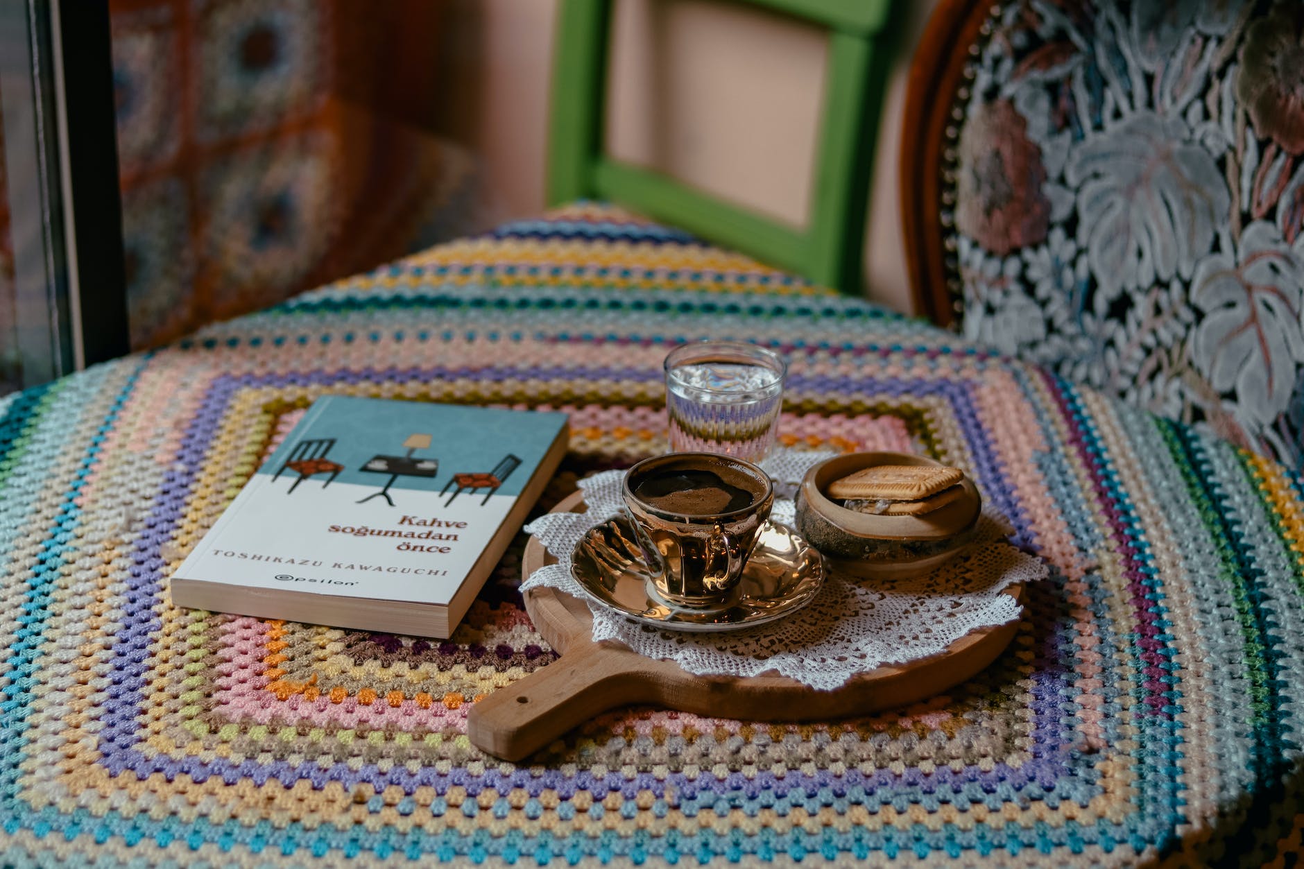 turkish coffee in a golden cup and woven tablecloth